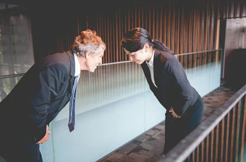 Man and woman bowing