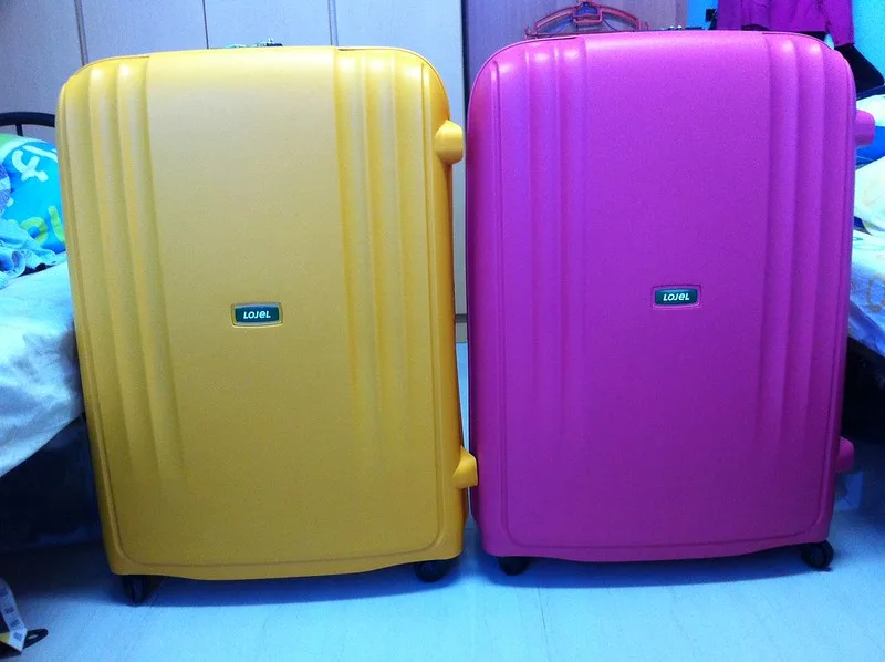 Yellow and purple Lojel Suitcases