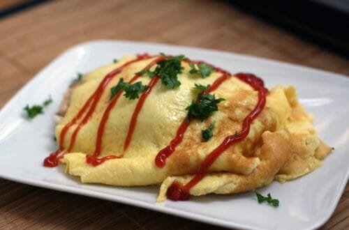A plate of Japanese omurice topped with ketchup